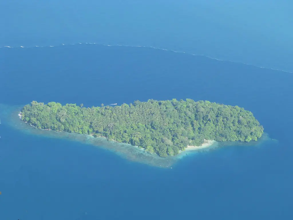 Island and boat in Madang Province